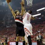 Portland Trail Blazers' Robin Lopez (42) puts up a shot against Houston Rockets' Terrence Jones (6) during the first half in Game 2 of an opening-round NBA basketball playoff series Wednesday, April 23, 2014, in Houston. (AP Photo/David J. Phillip)