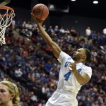 UCLA guard Norman Powell (4) sails to the basket against Stephen F. Austin in a third-round game in the NCAA college basketball tournament, Sunday, March 23, 2014, in San Diego. (AP Photo/Denis Poroy)