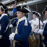 Revolutionary War reenactors, including Zachary Murphy, center, of Springfield, Ill., watch batting practice before a baseball game between the Chicago White Sox and the Seattle Mariners, Friday, July 4, 2014, in Chicago. (AP Photo/Andrew A. Nelles)