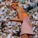 Russia's Maria Sharapova clenches her fist after winning the first set during final of the French Open tennis tournament against Romania's Simona Halep at the Roland Garros stadium, in Paris, France, Saturday, June 7, 2014. (AP Photo/Michel Spingler)