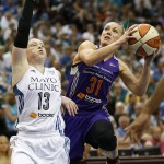 Phoenix Mercury guard Erin Phillips (31) looks up to the basket against the defense of Minnesota Lynx guard Lindsay Whalen (13) during the first half of Game 2 of the WNBA basketball Western Conference finals, Sunday, Aug. 31, 2014, in Minneapolis. The Lynx won 82-77. (AP Photo/Stacy Bengs)
