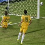  Australia's Alex Wilkinson, left, saves a goal during the group B World Cup soccer match between Chile and Australia in the Arena Pantanal in Cuiaba, Brazil, Friday, June 13, 2014. (AP Photo/Michael Sohn)