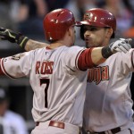  Arizona Diamondbacks' Gerardo Parra, right, celebrates with teammate Cody Ross (7) at home plate after hitting a two-run home run during the third inning of a baseball game against the Chicago White Sox in Chicago, Friday, May 9, 2014. (AP Photo/Paul Beaty)