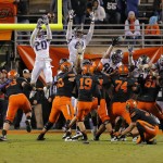 Oklahoma State place kicker Ben Grogan (19) attempts a field goal that went wide left during the second half of the Cactus Bowl NCAA college football game against Washington, Friday, Jan. 2, 2015, in Tempe, Ariz. Oklahoma State won 30-22. (AP Photo/Rick Scuteri)