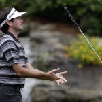 Bubba Watson reacts after missing a birdie on the 13th hole during the second round of the PGA Championship golf tournament at Valhalla Golf Club on Friday, Aug. 8, 2014, in Louisville, Ky. (AP Photo/David J. Phillip)