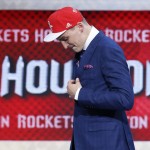 Sam Dekker walks off stage after being selected 18th overall by the Houston Rockets during the NBA basketball draft, Thursday, June 25, 2015, in New York. (AP Photo/Kathy Willens)
