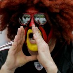 An Arizona Cardinals fan cheers prior to an NFL football game against the San Francisco 49ers, Sunday, Sept. 21, 2014, in Glendale, Ariz. (AP Photo/Rick Scuteri)
