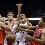 Milwaukee Bucks' Giannis Antetokounmpo (34) goes after a loose ball against Chicago Bulls' Derrick Rose (1), Joakim Noah, left, and Pau Gasol during the first overtime of Game 3 of an NBA basketball first-round playoff series Thursday, April 23, 2015, in Milwaukee. The Bulls won 113-106 in double overtime to take a 3-0 lead in the series. (AP Photo/Morry Gash)