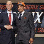 Syracuse's Tyler Ennis poses for a photo with NBA commissioner Adam Silver after being selected 18th overall by the Phoenix Suns during the 2014 NBA draft, Thursday, June 26, 2014, in New York. (AP Photo/Jason DeCrow)