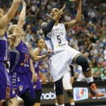 Minnesota Lynx guard Tan White (5) shoots the ball against Phoenix Mercury guard Erin Philips (31) during the second half of Game 2 of the WNBA basketball Western Conference finals, Sunday, Aug. 31, 2014, in Minneapolis. The Lynx won 82-77. (AP Photo/Stacy Bengs)