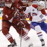 Arizona Coyotes' Connor Murphy (5) beats Montreal Canadiens' Lars Eller (81), of Denmark, to the puck during the first period of an NHL hockey game Saturday, March 7, 2015, in Glendale, Ariz. (AP Photo/Ross D. Franklin)
