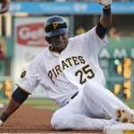 Pittsburgh Pirates' Gregory Polanco slides safely into third with a triple hit off Arizona Diamondbacks starting pitcher Chase Anderson during the first inning of a baseball game in Pittsburgh, Wednesday, July 2, 2014. (AP Photo/Gene J. Puskar)
