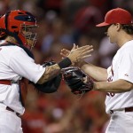 St. Louis Cardinals catcher Yadier Molina, left, and relief pitcher Trevor Rosenthal celebrate following the Cardinals' 4-2 victory over the Arizona Diamondbacks in a baseball game Thursday, May 22, 2014, in St. Louis. (AP Photo/Jeff Roberson)
