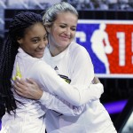Kristen Ledlow, right, hugs Mo'ne Davis as they are announced before the NBA All-Star celebrity basketball game Friday, Feb. 13, 2015, in New York. (AP Photo/Frank Franklin II)