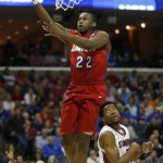 Dayton forward Kendall Pollard (22) shoots against Stanford during the second half in a regional semifinal game at the NCAA college basketball tournament, Thursday, March 27, 2014, in Memphis, Tenn. (AP Photo/John Bazemore)