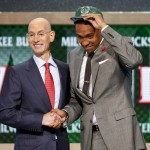 Jabari Parker of Duke poses for a photo with NBA Commissioner Adam Silver after being selected by the Milwaukee Bucks as the number two overall pick during the 2014 NBA draft, Thursday, June 26, 2014, in New York. (AP Photo/Jason DeCrow)