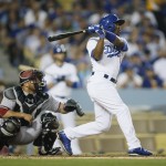 Los Angeles Dodgers shortstop Jimmy Rollins hits a three run home run in front of Arizona Diamondbacks catcher Welington Castillo to score Alex Guerrero and Andre Ethier during the fourth inning of a baseball game, Monday, June 8, 2015, in Los Angeles. (AP Photo/Danny Moloshok)