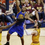 Golden State Warriors guard Leandro Barbosa (19) goes up for a shot over Cleveland Cavaliers guard Matthew Dellavedova (8) during the first half of Game 4 of basketball's NBA Finals in Cleveland, Thursday, June 11, 2015. (AP Photo/Paul Sancya)