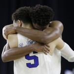 Duke's Justise Winslow and Tyus Jones (5) celebrate after a college basketball regional final game against Gonzaga in the NCAA Tournament Sunday, March 29, 2015, in Houston. Duke won 66-52. (AP Photo/David J. Phillip)
