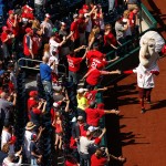 Nationals presidents mascots greets fans before a baseball game between the Washington Nationals and the New York Mets on opening day at at Nationals Park, Monday, April 6, 2015, in Washington. (AP Photo/Andrew Harnik)