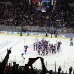 The New York Islanders celebrate at center ice after beating the Washington Capitals 3-1 in Game 6 in the first round of the NHL hockey Stanley Cup playoffs, Saturday, April 25, 2015, in Uniondale, N.Y. (AP Photo/Julie Jacobson)