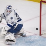 Tampa Bay Lightning goalie Anders Lindback is scored on by Montreal Canadiens' Lars Eller (not shown) during first period NHL Stanley Cup playoff action in Montreal, Tuesday, April 22, 2014. (AP Photo/The Canadian Press, Graham Hughes)