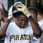 Pittsburgh Pirates' Gregory Polanco celebrates with teammates in the dugout after hitting a two-run home run off Arizona Diamondbacks starting pitcher Chase Anderson during the second inning of a baseball game in Pittsburgh Wednesday, July 2, 2014. (AP Photo/Gene J. Puskar)
