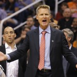Golden State Warriors coach Steve Kerr reacts to a call in the first quarter during an NBA basketball game against the Phoenix Suns, Sunday, Nov. 9, 2014, in Phoenix. (AP Photo/Rick Scuteri)