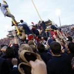 Mississippi students bring down a goal post after their 23-17 win over No. 3 Alabama in an NCAA college football game in Oxford, Miss., Saturday, Oct. 4, 2014. (AP Photo/Rogelio V. Solis)