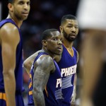 Phoenix Suns' Eric Bledsoe, center, looks on after receiving his second technical foul as he's ejected in the third quarter of an NBA basketball game against the Atlanta Hawks Tuesday, April 7, 2015, in Atlanta. The Hawks won 96-69. (AP Photo/David Goldman)