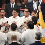 Gail Banawis, accompanied by The Word Chorale, a chorus composed of pastors, sings the Philippine national anthem before Floyd Mayweather Jr., and Manny Pacquiao's welterweight title fight on Saturday, May 2, 2015 in Las Vegas. (AP Photo/Eric Jamison)