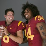 Southern California quarterback Cody Kessler, left, and defensive end Leonard Williams pose for photos at the Pac-12 NCAA college football media days at Paramount Studios in Los Angeles, Wednesday, July 23, 2014. (AP Photo)