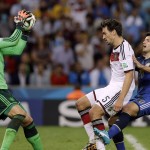 Germany's goalkeeper Manuel Neuer, left, makes a save as Germany's Mats Hummels and Argentina's Sergio Aguero, right, look on during the World Cup final soccer match between Germany and Argentina at the Maracana Stadium in Rio de Janeiro, Brazil, Sunday, July 13, 2014. (AP Photo/Victor R. Caivano)