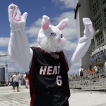  A person dressed as the Easter Bunny wears a LeBron James jersey and waves to fans as they arrive for Game 1 of an opening-round NBA basketball playoff series between the Miami Heat and the Charlotte Bobcats, Sunday, April 20, 2014, in Miami. (AP Photo/Lynne Sladky)