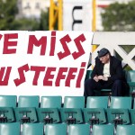 A lone man sits in the stand with a banner refeering to former German tennis ace Steffi Graf during on a court during the French Open tennis tournament at the Roland Garros stadium, in Paris, France, Saturday, June 7, 2014. (AP Photo/Darko Vojinovic)