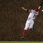  Arizona Diamondbacks center fielder Tony Campana misses the catch on an RBI double hit by the Chicago Cubs' Travis Wood during the fourth inning of a baseball game on Monday, April 21, 2014, in Chicago. (AP Photo/Andrew A. Nelles)