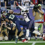 Seattle Seahawks wide receiver Chris Matthews (13) catches a pass in front of New England Patriots cornerback Kyle Arrington (25) during the first half of NFL Super Bowl XLIX football game Sunday, Feb. 1, 2015, in Glendale, Ariz. (AP Photo/Matt York)