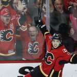 Calgary Flames' Johnny Gaudreau celebrates his goal against the Vancouver Canucks during the second period of Game 6 of a first-round NHL hockey playoff series, Saturday, April 25, 2015, in Calgary, Alberta. (Jeff McIntosh/The Canadian Press via AP)