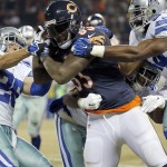 Chicago Bears tight end Martellus Bennett (83) catches a pass thrown by quarterback Jay Cutler against Dallas Cowboys defense during the second half of an NFL football game Thursday, Dec. 4, 2014, in Chicago. (AP Photo/Charles Rex Arbogast)
