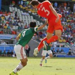  Mexico's Rafael Marquez pushes off Netherlands' Stefan de Vrij as he heads the ball during the World Cup round of 16 soccer match between the Netherlands and Mexico at the Arena Castelao in Fortaleza, Brazil, Sunday, June 29, 2014. (AP Photo/Eduardo Verdugo)