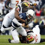 Penn State quarterback Christian Hackenberg (14) is sacked by Maryland linebacker Jesse Aniebonam, left, and Andre Monroe during the first half of an NCAA college football game in State College, Pa., Saturday, Nov. 1, 2014. (AP Photo/Gene J. Puskar)