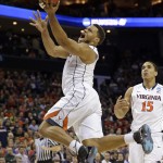 Virginia's Justin Anderson drives to the basket against Belmont during the first half of an NCAA tournament college basketball game in the Round of 64 in Charlotte, N.C., Friday, March 20, 2015. (AP Photo/Gerald Herbert)