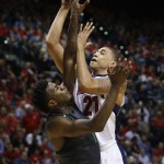 Arizona's Brandon Ashley, right, shoots over Oregon's Casey Benson during the second half of an NCAA college basketball game in the championship of the Pac-12 conference tournament Saturday, March 14, 2015, in Las Vegas. Arizona won 80-52. (AP Photo/John Locher)