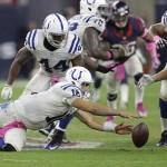 Indianapolis Colts' Andrew Luck (12) loses the ball during the second half of an NFL football game against the Houston Texans, Thursday, Oct. 9, 2014, in Houston. Houston's J.J. Watt recovered the ball and returned it for a 45-yard touchdown. (AP Photo/Patric Schneider)