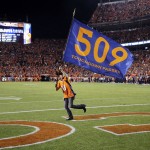 A banner is waved after Denver Broncos quarterback Peyton Manning threw his 509th career touchdown pass during the first half of an NFL football game against the San Francisco 49ers, Sunday, Oct. 19, 2014, in Denver. Manning has broken Brett Favre's record for touchdown passes with his 509th. (AP Photo/Brennan Linsley)