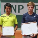 Russia's Andrey Rublev, right, holds the trophy after winning the junior boys final match of the French Open tennis tournament against Spain's Jaume Antoni Munar Clar, left, at the Roland Garros stadium, in Paris, France, Saturday, June 7, 2014. Rublev won in two sets 6-2, 7-5. (AP Photo/Thibault Camus)