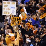 San Francisco Giants fans cheer during the seventh inning of Game 4 of baseball's World Series against the Kansas City Royals on Saturday, Oct. 25, 2014, in San Francisco. (AP Photo/Charlie Riedel)