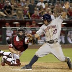 Arizona Diamondbacks' Miguel Montero, left, tags Houston Astros' Jose Altuve (27) out at home plate during the ninth inning of a baseball game on Monday, June 9, 2014, in Phoenix. The Astros won 4-3. (AP Photo/Ross D. Franklin)