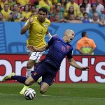 Netherlands' Arjen Robben, front, is tripped by Brazil's Thiago Silva during the World Cup third-place soccer match between Brazil and the Netherlands at the Estadio Nacional in Brasilia, Brazil, Saturday, July 12, 2014. The Netherlands scored on a penalty shot awarded for the incident. (AP Photo/Natacha Pisarenko)