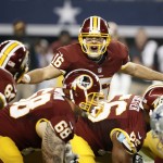 Washington Redskins' Colt McCoy instructs the line of scrimmage during the first half of an NFL football game against the Dallas Cowboys, Monday, Oct. 27, 2014, in Arlington, Texas. (AP Photo/Brandon Wade)